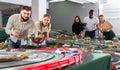 Young couples play a game slot car racing track Royalty Free Stock Photo