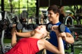 Young couples work out at the gym to strengthen the body