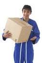 Young courier boy moving boxes Royalty Free Stock Photo