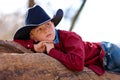 Young cowboy reclining Royalty Free Stock Photo