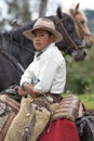 Young cowboy sitting in saddle