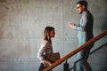 Young business people climb the stairs in the office building Royalty Free Stock Photo