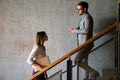 Young business people climb the stairs in the office building Royalty Free Stock Photo