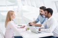 Young coworkers having brainstorming session in modern office Royalty Free Stock Photo