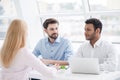 Young coworkers having brainstorming session in modern office Royalty Free Stock Photo