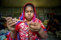 A young crafts maker is making a showpiece from the fibers of a banana tree at Madhupur, Tangail, Bangladesh