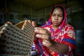 A young crafts maker is making a showpiece from the fibers of a banana tree at Madhupur, Tangail, Bangladesh