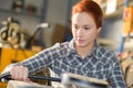 young craftswoman produces objects in workshop Royalty Free Stock Photo