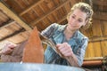 Young craftswoman produces objects in workshop Royalty Free Stock Photo