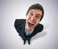 Young crazy businessman or boss is screaming. View from top Royalty Free Stock Photo