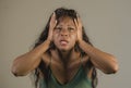 Young crazy desperate and anxious black african American woman feeling stressed and tormented in intense and dramatic face express Royalty Free Stock Photo