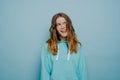 Young crazy pretty girl in light blue hoodie Royalty Free Stock Photo