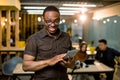 Young creative African man in modern office. Group of young Multiracial people are working together with laptop, tablet Royalty Free Stock Photo