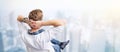 Young creative man overlooking city from above. Royalty Free Stock Photo
