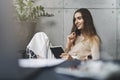 Young creative manager working on new interesting projects. Female executive planning work in office. Girl writing notes in Royalty Free Stock Photo