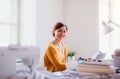 Young creative woman in a studio, startup of small tailoring business. Royalty Free Stock Photo