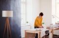 Young creative woman in a studio, startup of small tailoring business. Royalty Free Stock Photo