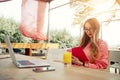 Young creative woman work on laptop while having breakfast on terrace Royalty Free Stock Photo