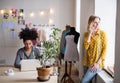 Young creative women with laptop in studio, startup business. Royalty Free Stock Photo