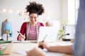 Young creative women in a studio, startup business. Royalty Free Stock Photo