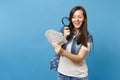 Young curious woman student with backpack look on bundle lots of dollars, cash money with magnifying glass check