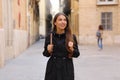 Young curious woman travelling and visiting Europe in winter time. Backpacker girl walking in Valencia admiring spanish Royalty Free Stock Photo