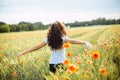 Young woman running through a field of wildflowers Royalty Free Stock Photo