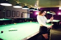 Young curly girl posed near billiard table Royalty Free Stock Photo