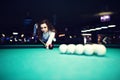 Young curly girl posed near billiard table Royalty Free Stock Photo