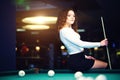 Young curly girl posed near billiard table Royalty Free Stock Photo