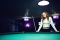 Young curly girl posed near billiard table Royalty Free Stock Photo