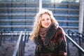 Young curly woman using her phone and relax in the city Royalty Free Stock Photo