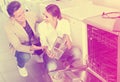 Young customers choosing new dish washing machine Royalty Free Stock Photo