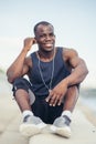 Man listening to music in his earphones, meditating, looking far away, dreaming Royalty Free Stock Photo