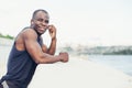 Young jogger listening to meditative music with earphones Royalty Free Stock Photo