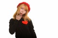 Young cute Asian woman with red heart on chest and blowing kiss Royalty Free Stock Photo
