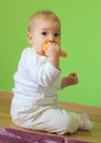 Young cute baby sitting on floor