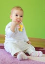 Young cute baby sitting on floor Royalty Free Stock Photo