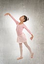 Young cute ballet dancer on white background