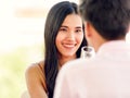 A young and cute beautiful Asian woman drinking white wine and talking to man with love and happy Royalty Free Stock Photo