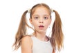 Young cute bemused puzzled girl with grey blue eyes and two hair tails