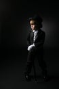 Young, cute boy in formal black tuxedo Royalty Free Stock Photo