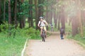 Young cute boy in helmet rides a bicycle in the park. Boy goes on the road. Sport Royalty Free Stock Photo