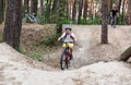 Young cute boy in helmet rides a bicycle in the park. Boy goes on the road. Sport Royalty Free Stock Photo