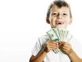 Young cute boy holding lot of cash, american dollars Royalty Free Stock Photo