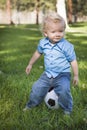 Young Cute Boy Playing with Soccer Ball in Park Royalty Free Stock Photo