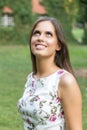 Young cute brunette girl smiling in the park. Close up Royalty Free Stock Photo