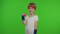 Caucasian girl in sportswear making exercises with dumbbells. Workout for kids. Athletic child