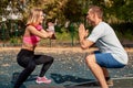 Young Cute Couple Exercising At The City Park. Outdoor Sport. Royalty Free Stock Photo