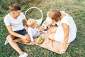 Young cute family on picnic with dog Royalty Free Stock Photo